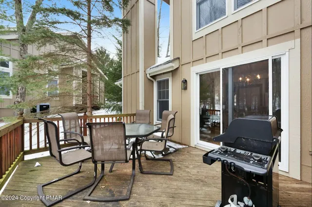 a couple of chairs sitting in front of building