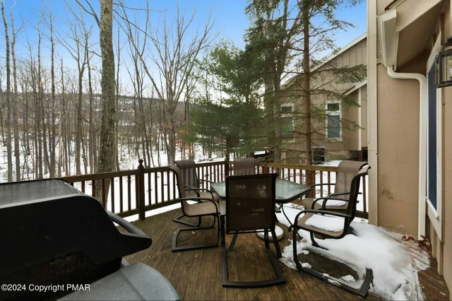 a view of a chairs and tables in the back yard of the house