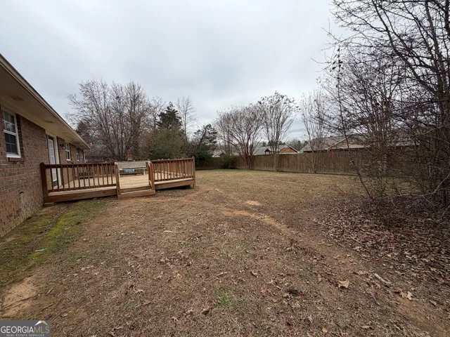 a view of backyard with green space