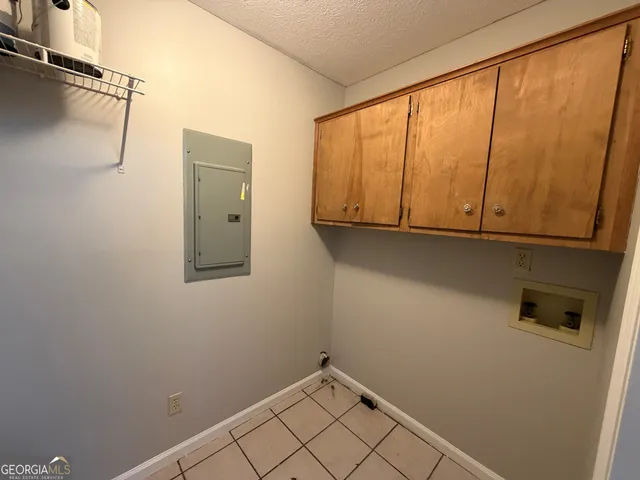 a view of storage and utility room with a sink