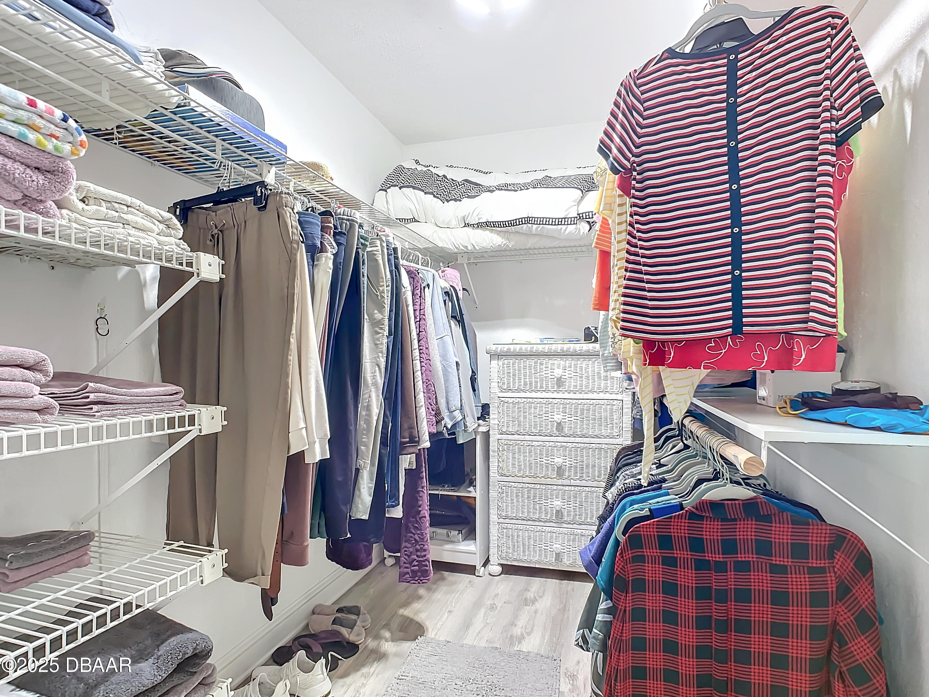 39 Crooked Pine Road Port Orange, FL 32128 - Photo 28 of 47 a view of walk in closet with clothes and shoes