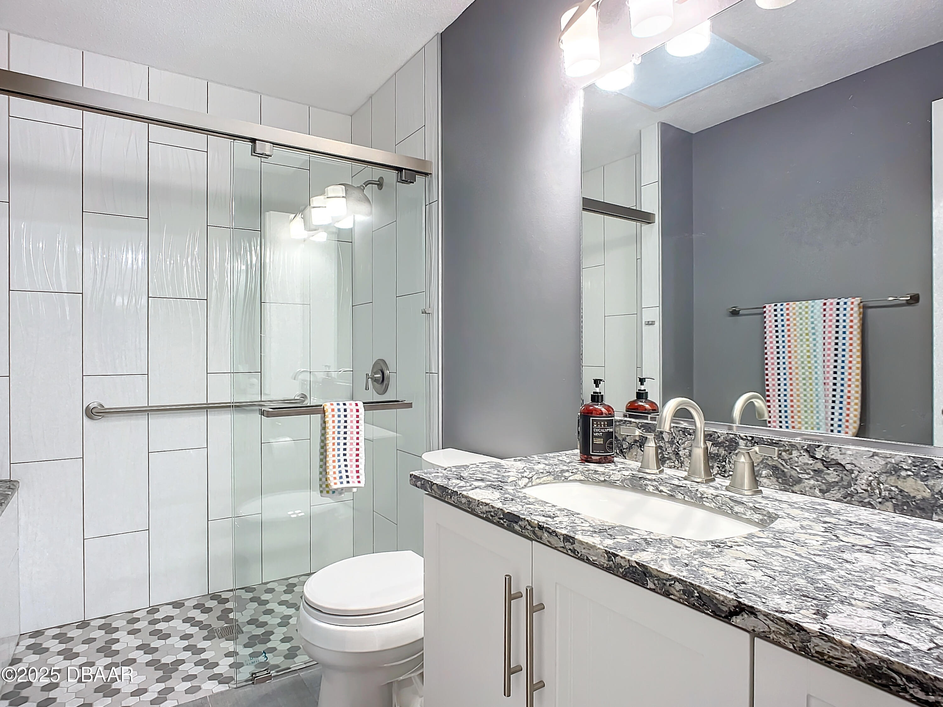 39 Crooked Pine Road Port Orange, FL 32128 - Photo 29 of 47 a bathroom with a granite countertop sink toilet and shower