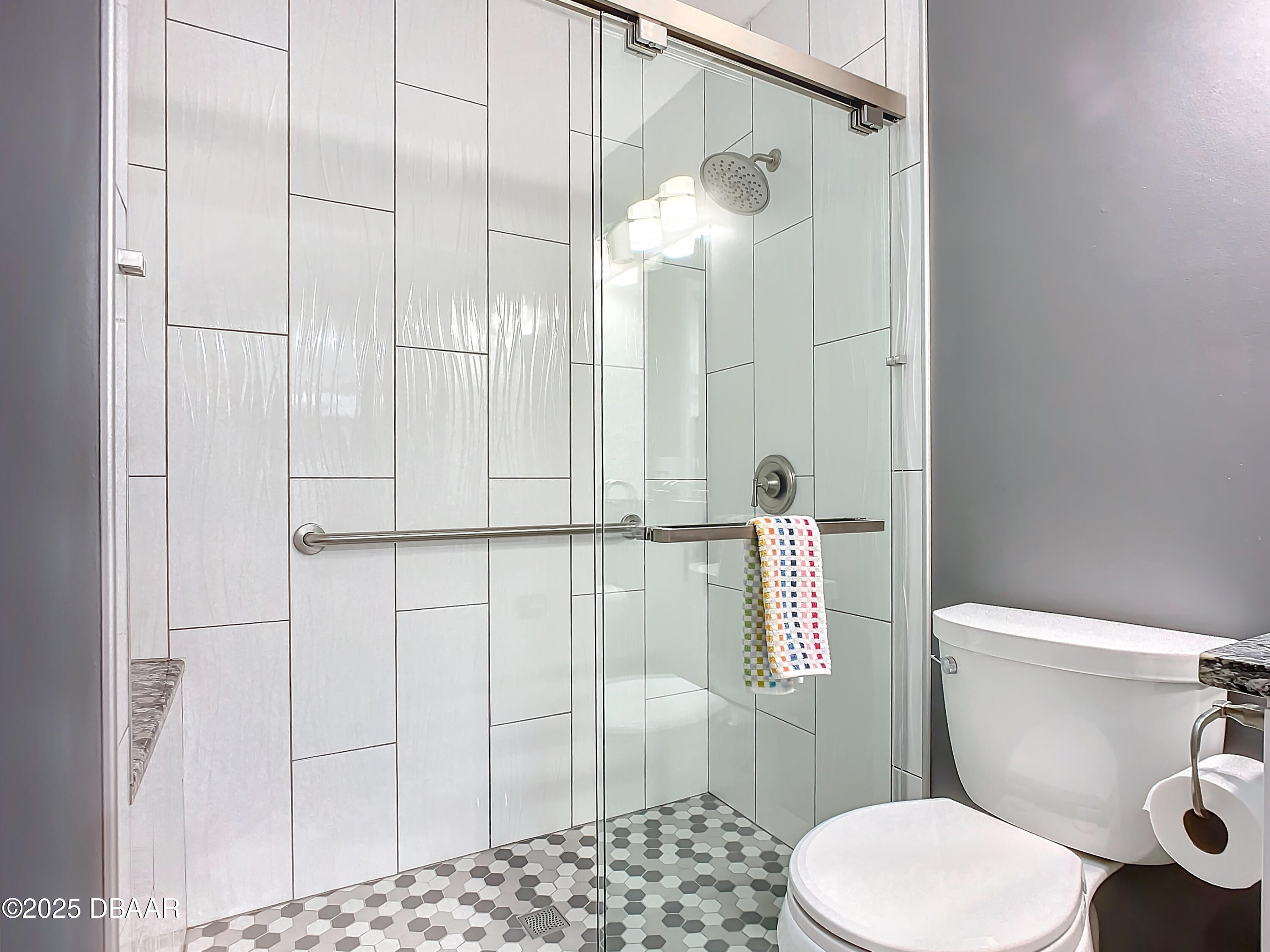 39 Crooked Pine Road Port Orange, FL 32128 - Photo 30 of 47 a white toilet sitting next to a bathroom sink