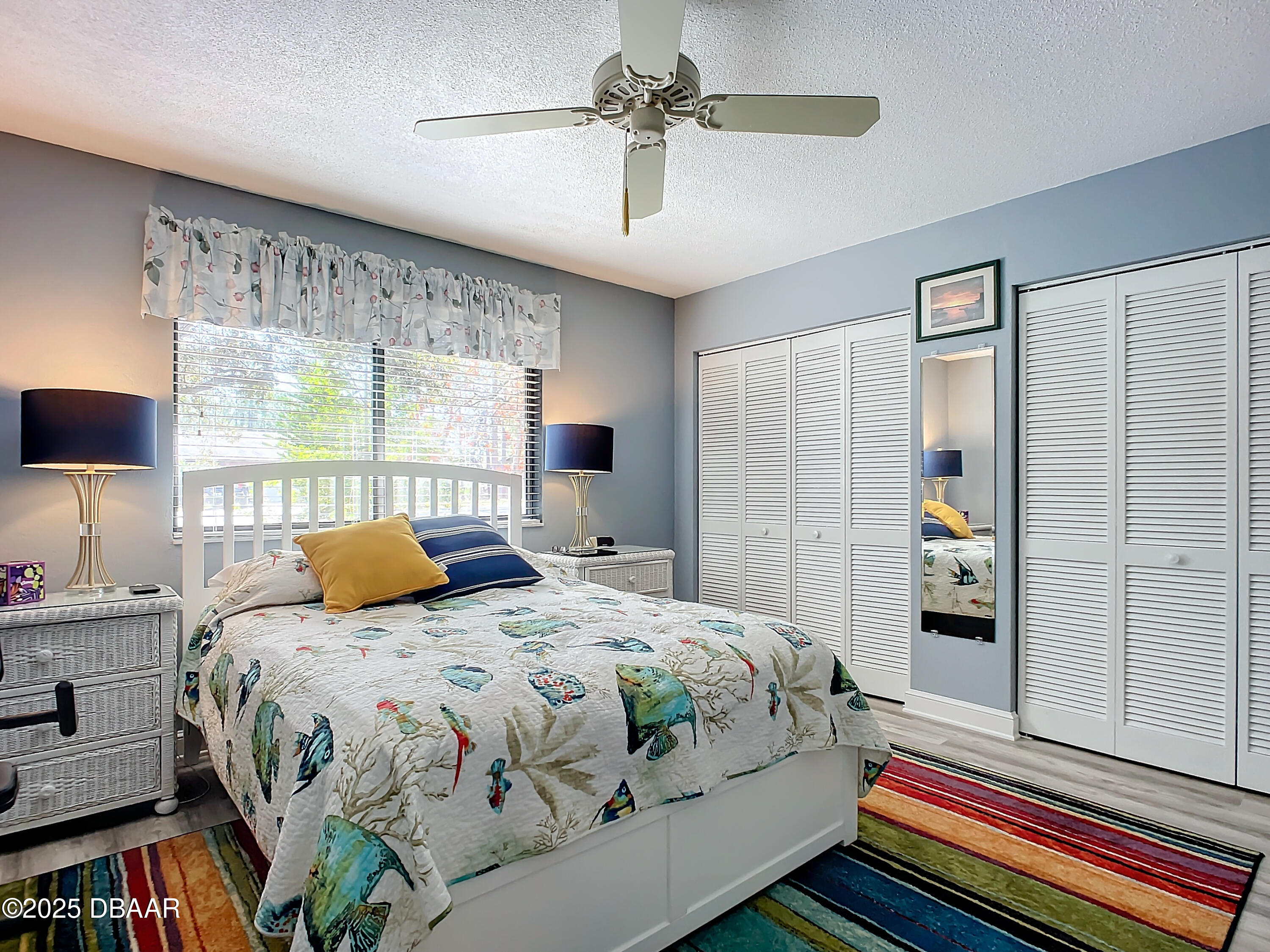 39 Crooked Pine Road Port Orange, FL 32128 - Photo 31 of 47 a bedroom with a bed and a chandelier