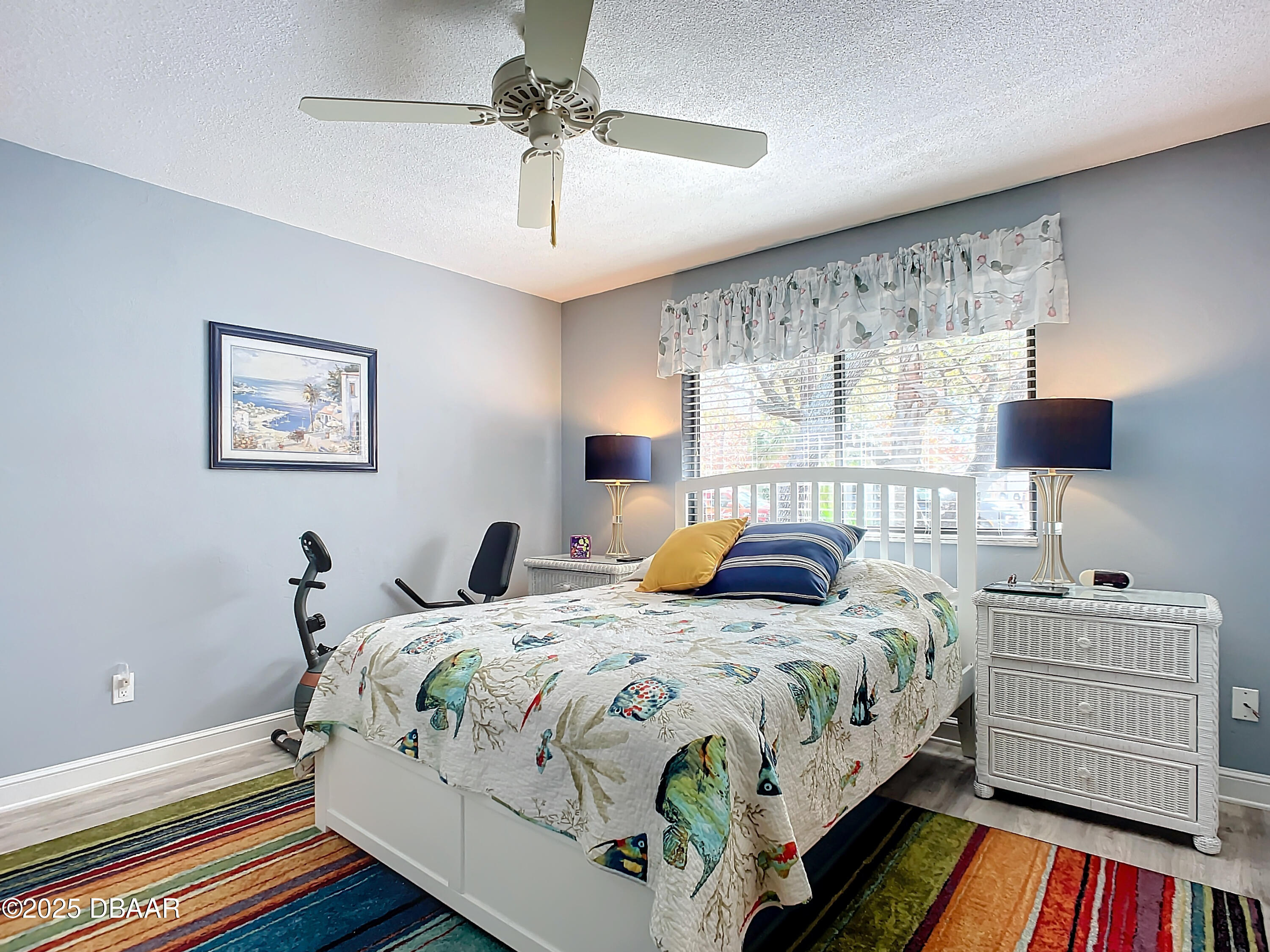 39 Crooked Pine Road Port Orange, FL 32128 - Photo 32 of 47 a bedroom with a bed and a chandelier