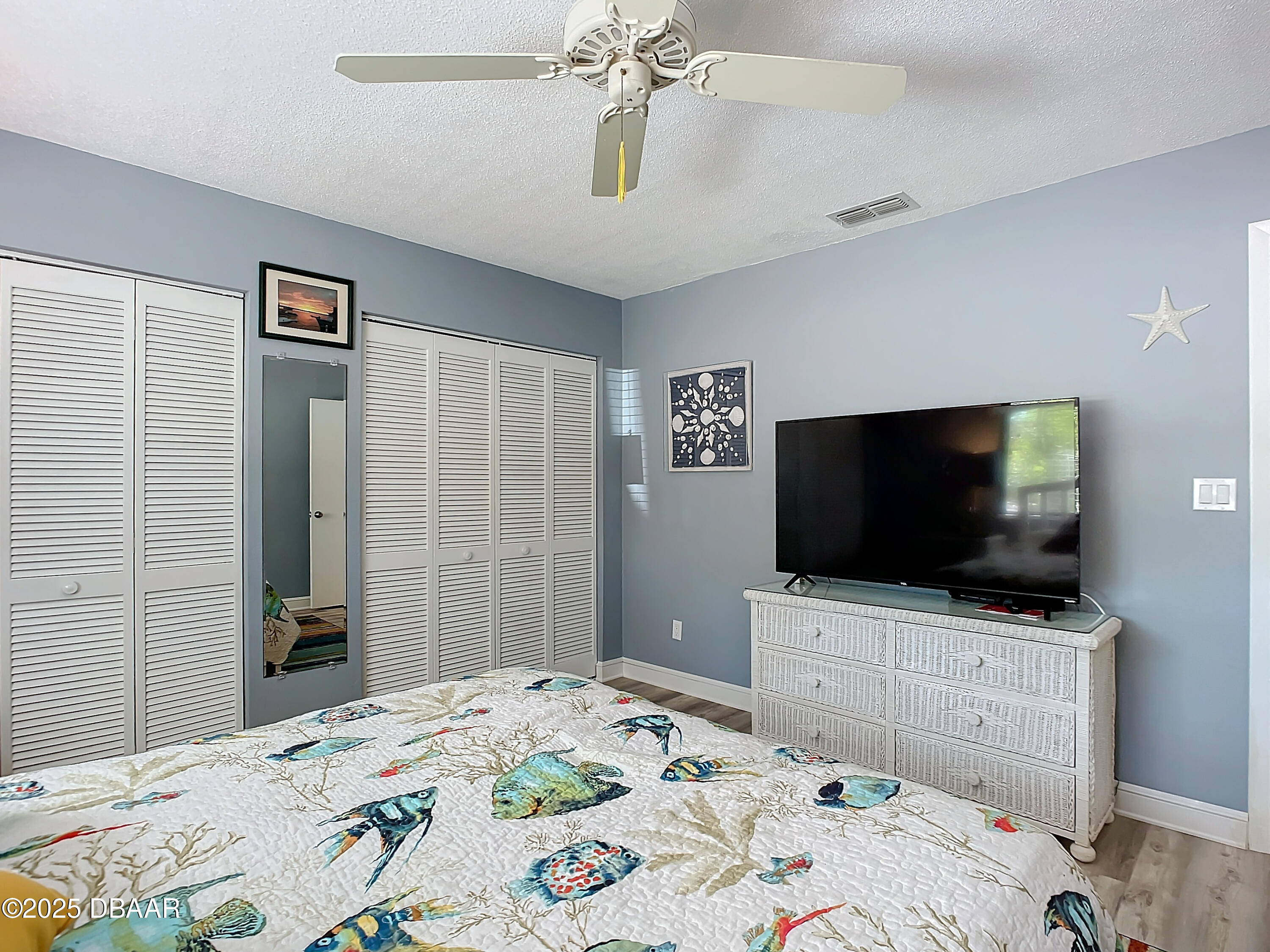 39 Crooked Pine Road Port Orange, FL 32128 - Photo 33 of 47 a bedroom with a bed and a flat screen tv