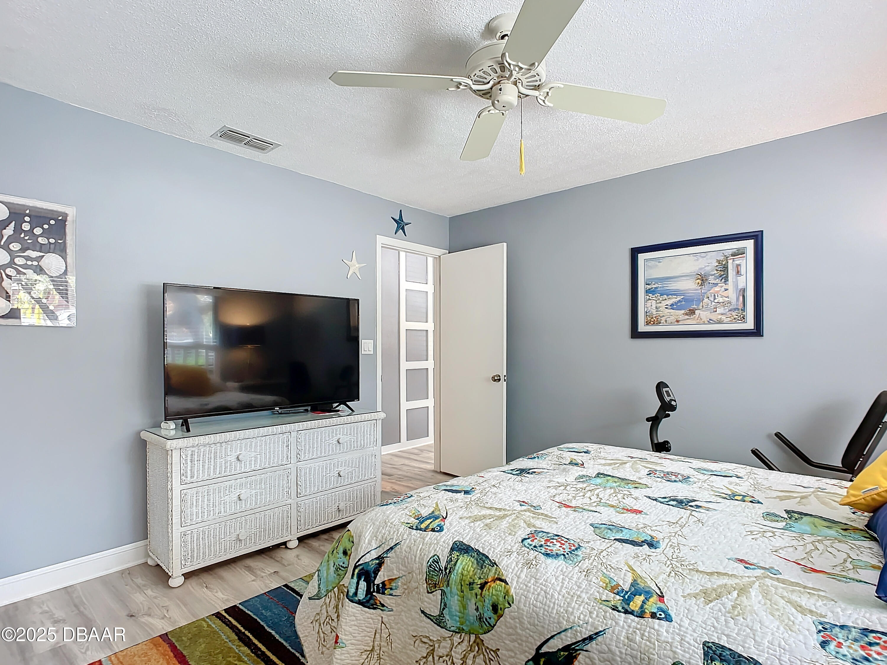 39 Crooked Pine Road Port Orange, FL 32128 - Photo 34 of 47 a bedroom with a bed and a flat screen tv