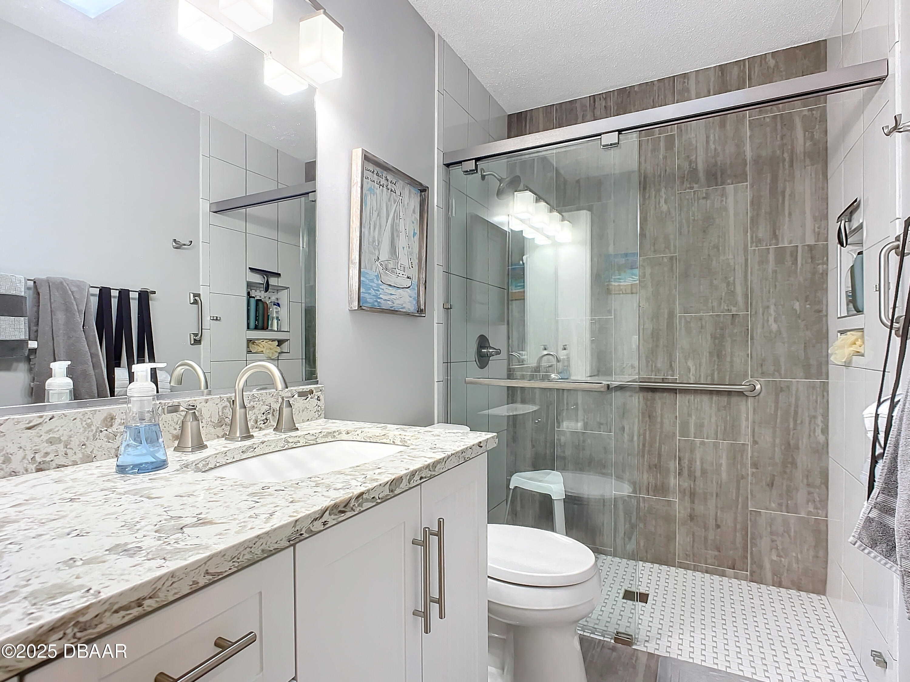 39 Crooked Pine Road Port Orange, FL 32128 - Photo 35 of 47 a bathroom with a granite countertop sink toilet and shower