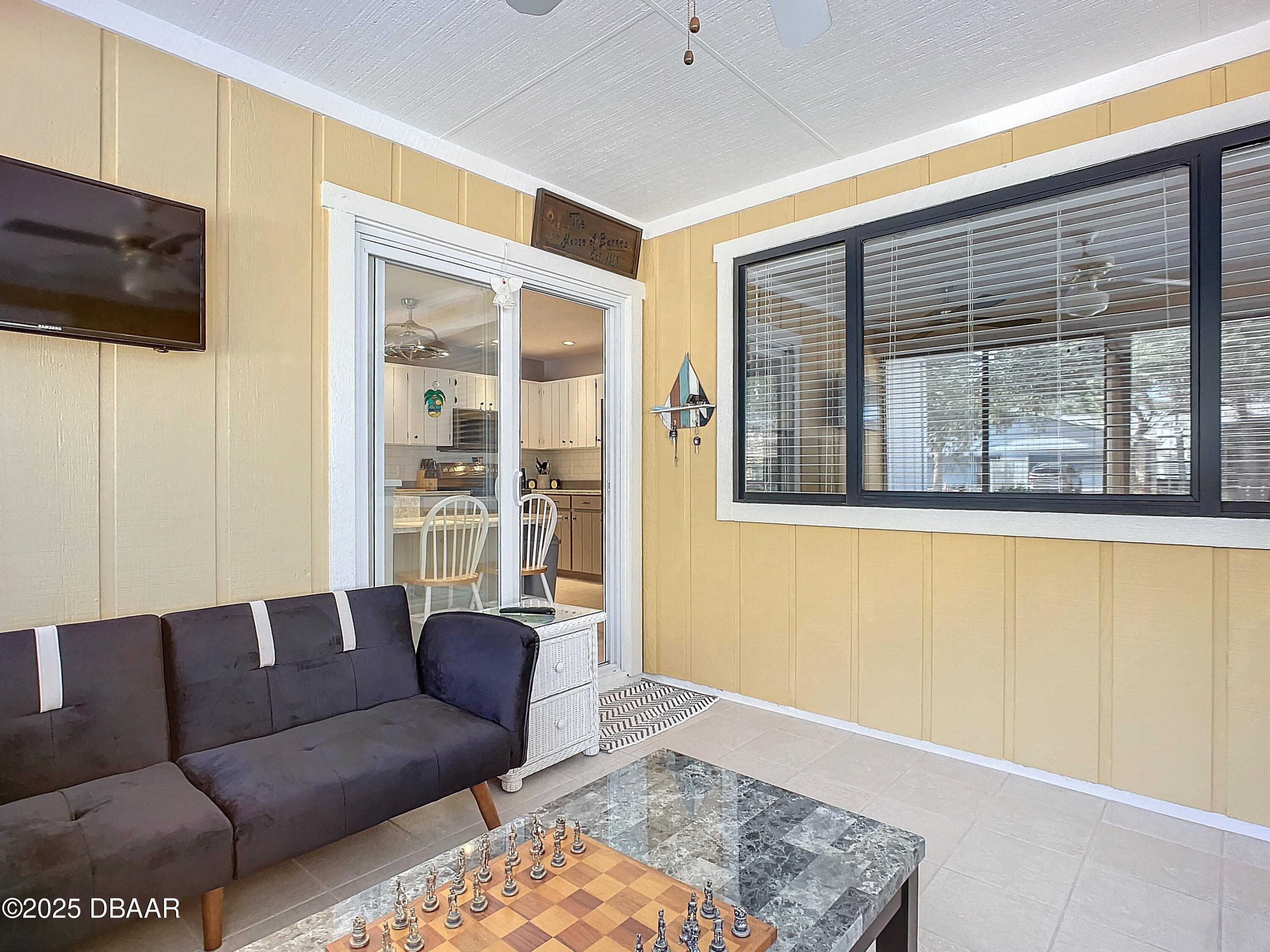 39 Crooked Pine Road Port Orange, FL 32128 - Photo 38 of 47 a living room with furniture and a flat screen tv