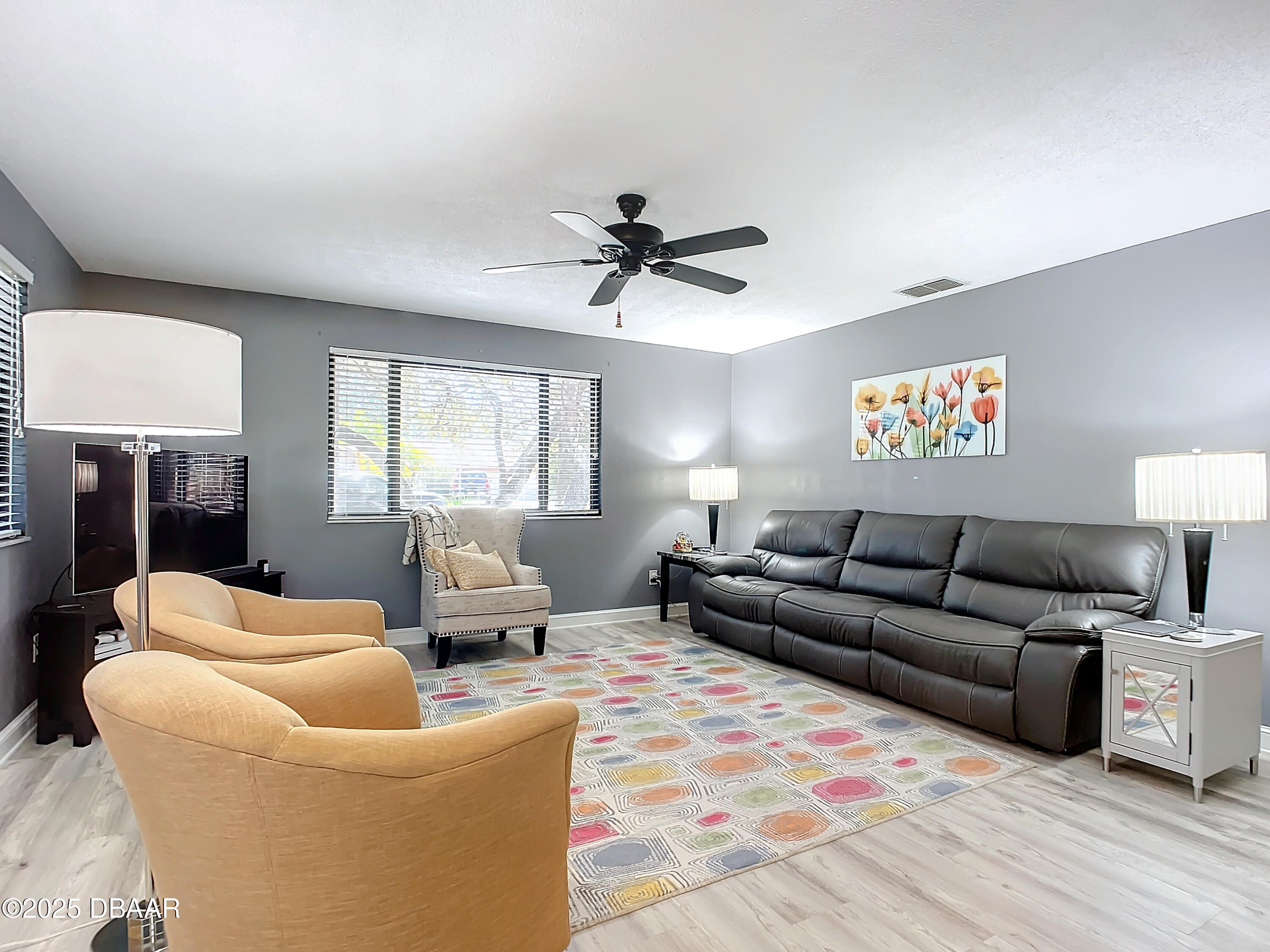 39 Crooked Pine Road Port Orange, FL 32128 - Photo 8 of 47 a living room with furniture ceiling fan and a window
