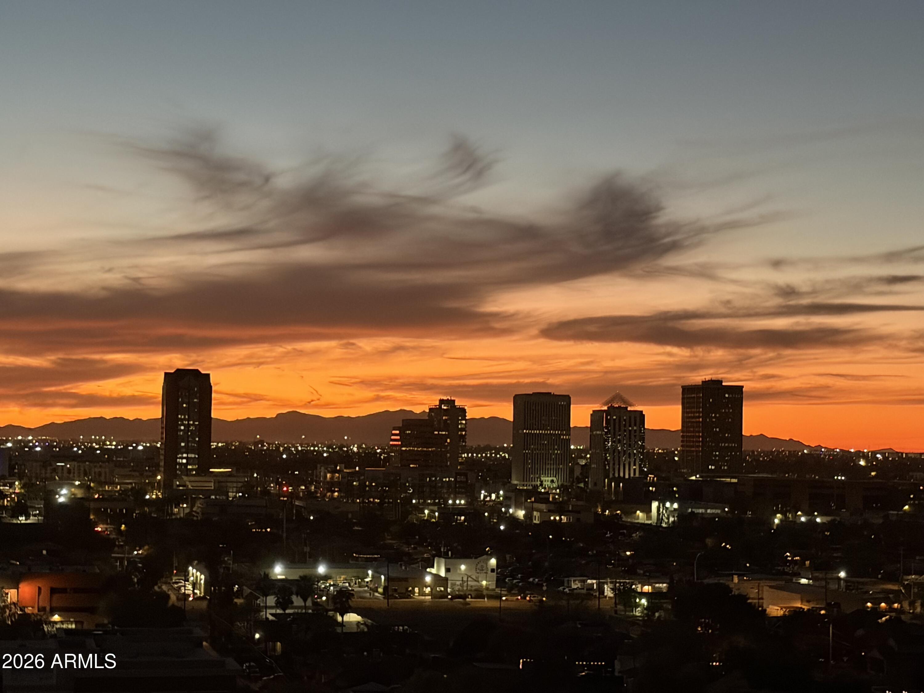 1040 East Osborn Road, Unit 1103 Phoenix, AZ 85014 - Photo 46 of 49 a view of a city with sunset