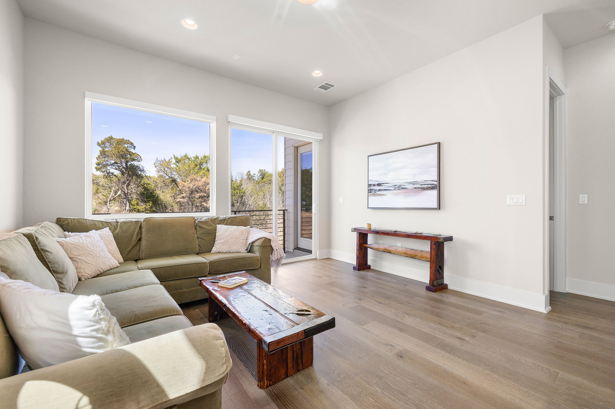 5214 Pink Poppy Pass Austin, TX 78735 - Photo 25 of 34 Living area featuring wood finished floors and recessed lighting