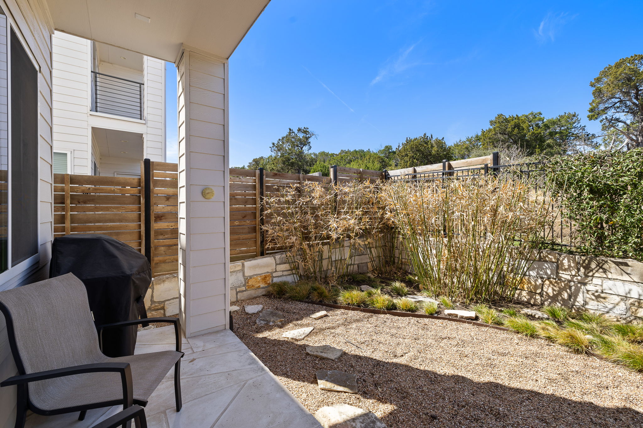 5214 Pink Poppy Pass Austin, TX 78735 - Photo 28 of 34 Fenced backyard featuring a patio and a grill