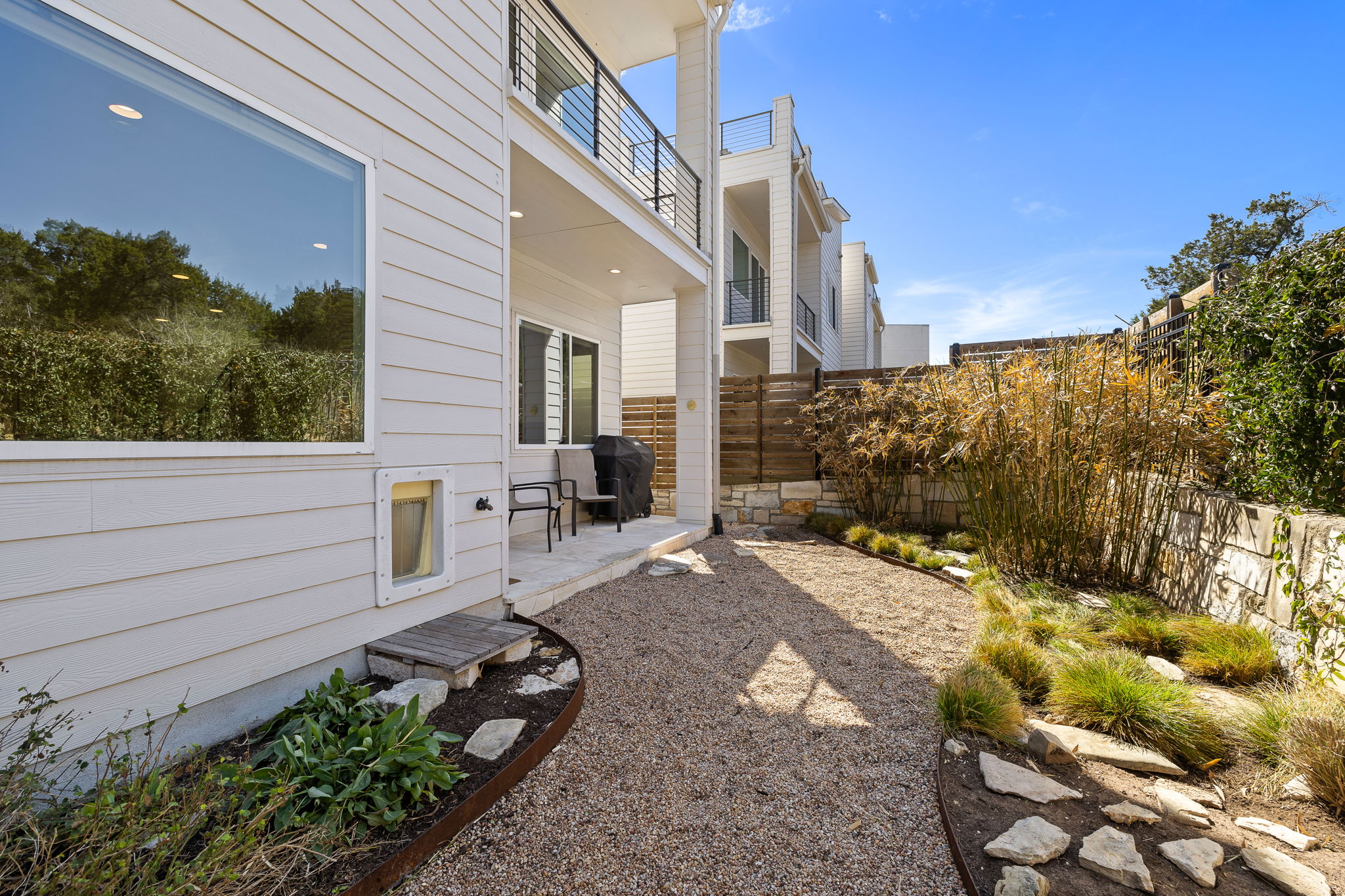 5214 Pink Poppy Pass Austin, TX 78735 - Photo 30 of 34 Fenced backyard with a balcony and a patio