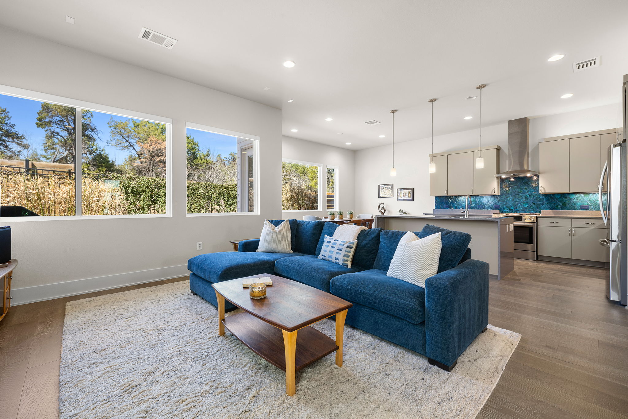 5214 Pink Poppy Pass Austin, TX 78735 - Photo 7 of 34 Living room with light wood-style flooring and recessed lighting