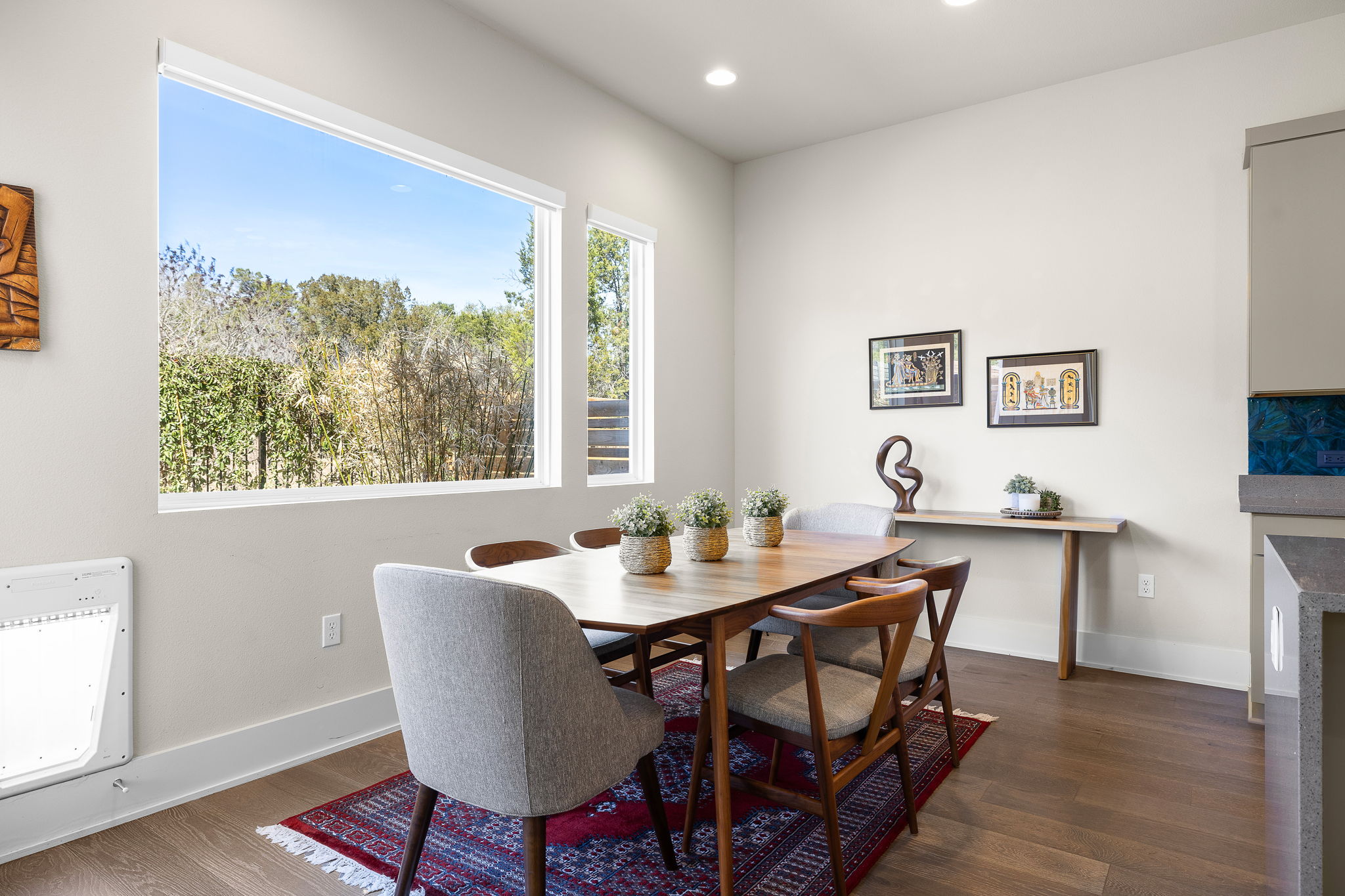 5214 Pink Poppy Pass Austin, TX 78735 - Photo 9 of 34 Dining room featuring dark wood-style floors, recessed lighting, heating unit, and a glass covered fireplace