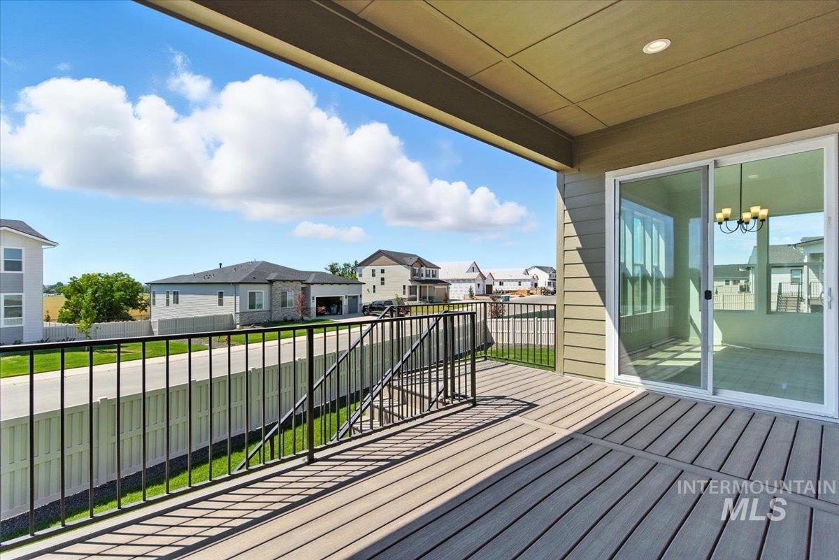 1275 Stirling Mdws Street Middleton, ID 83644 - Photo 38 of 42 Wooden terrace featuring a residential view and a lawn