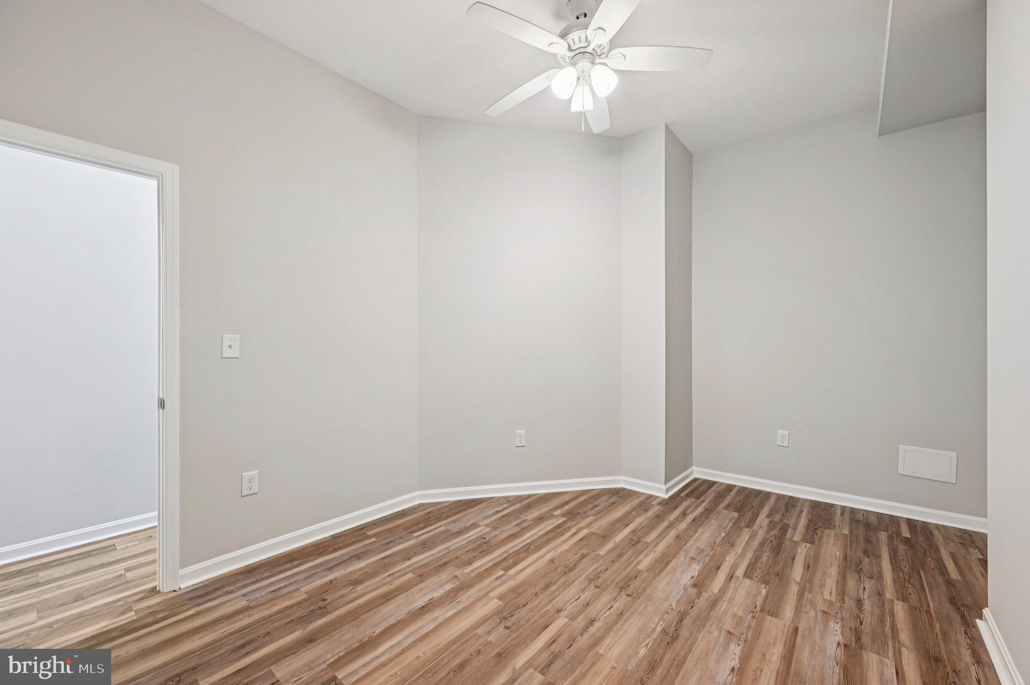 750 Reservoir Street, Unit A Baltimore, MD 21217 - Photo 19 of 23 a view of a room with wooden floor and closet