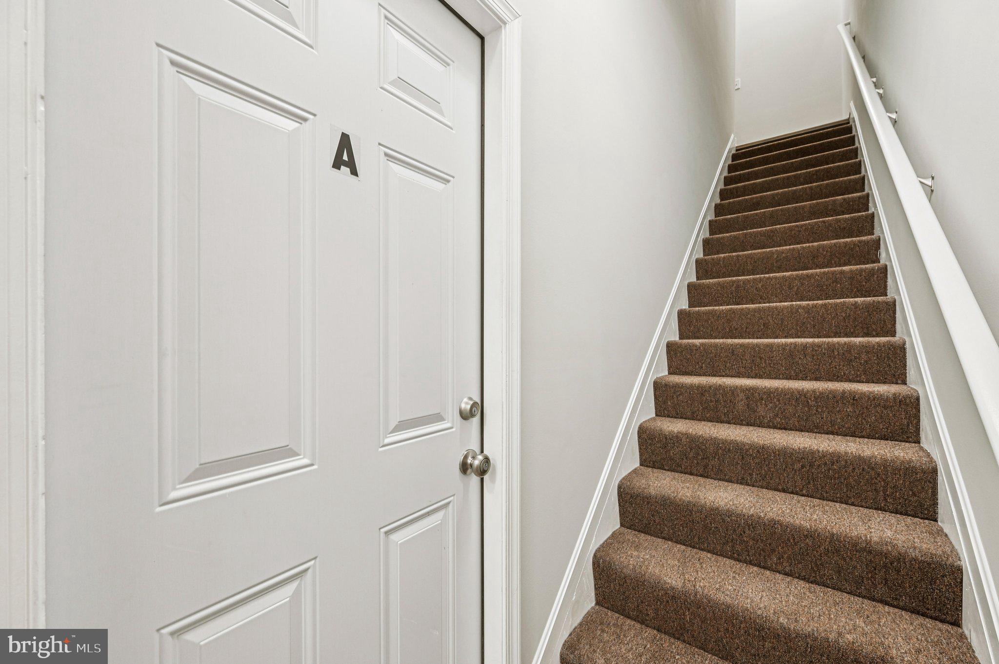 750 Reservoir Street, Unit A Baltimore, MD 21217 - Photo 6 of 23 a view of staircase with white walls