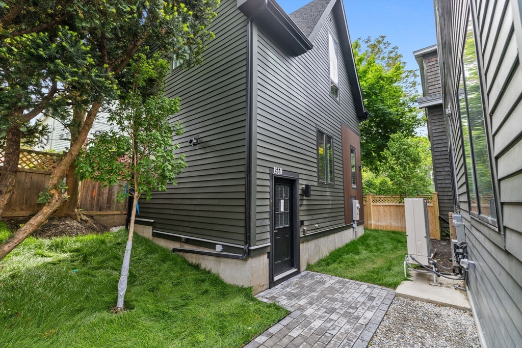 156 Albion Street, Unit R Somerville, MA 02144 - Photo 2 of 21 a view of a house with a yard and a large tree