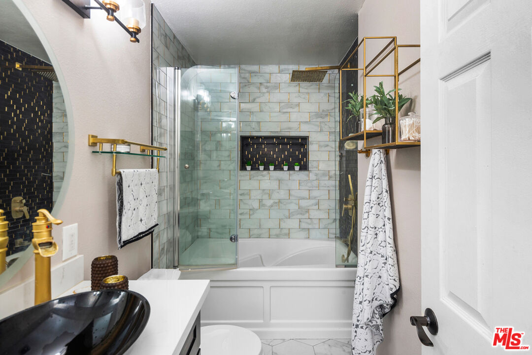 3800 Stocker Street, Unit 23 View Park, CA 90008 - Photo 15 of 33 a bathroom with a bathtub and shower