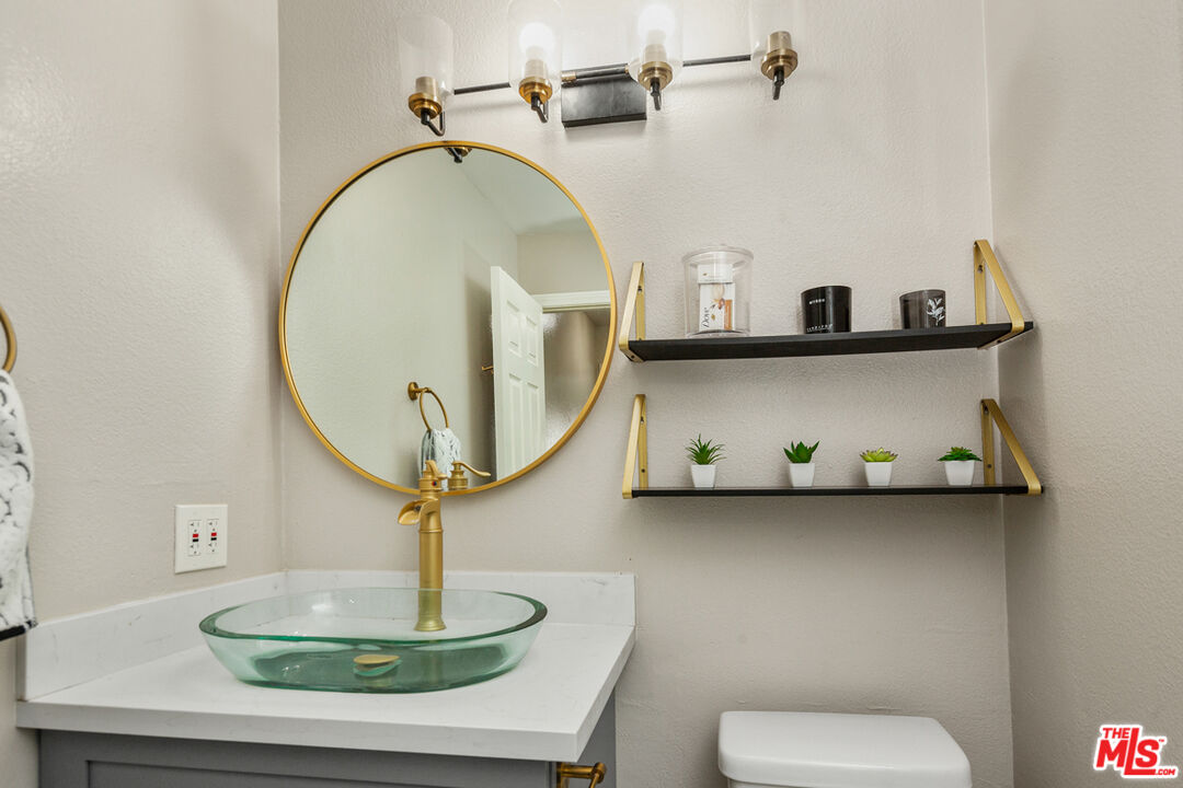 3800 Stocker Street, Unit 23 View Park, CA 90008 - Photo 18 of 33 a bathroom with a sink and a mirror