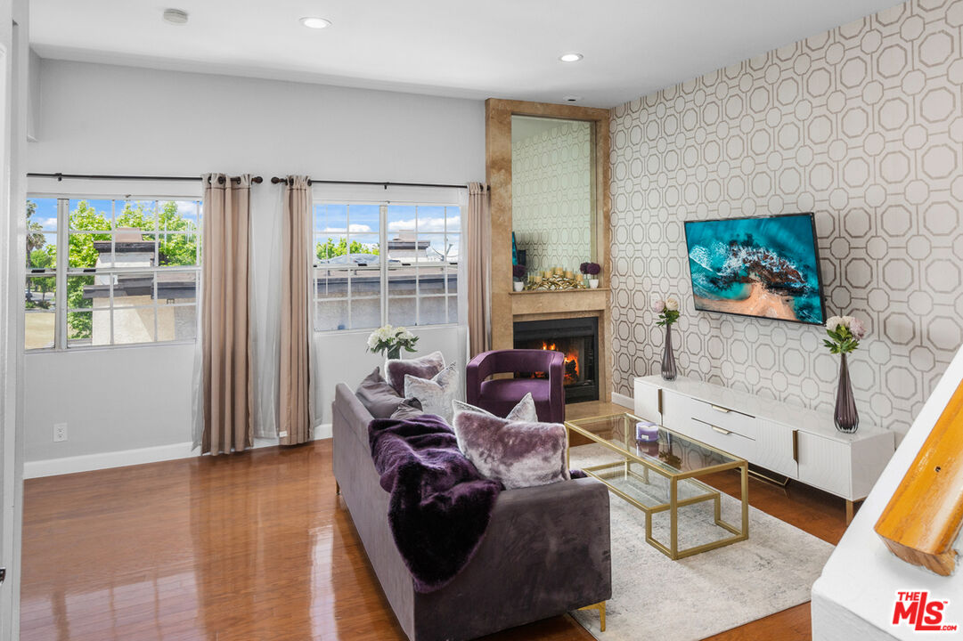 3800 Stocker Street, Unit 23 View Park, CA 90008 - Photo 21 of 33 a living room with furniture and a flat screen tv