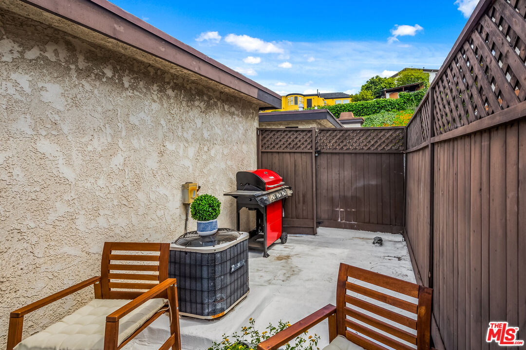 3800 Stocker Street, Unit 23 View Park, CA 90008 - Photo 24 of 33 a outdoor living space with furniture and a potted plant