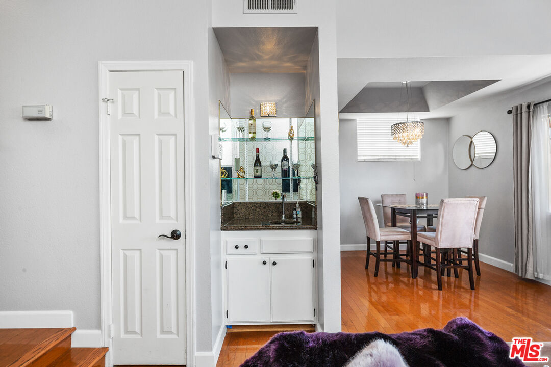 3800 Stocker Street, Unit 23 View Park, CA 90008 - Photo 5 of 33 a view of a dining room with furniture and wooden floor