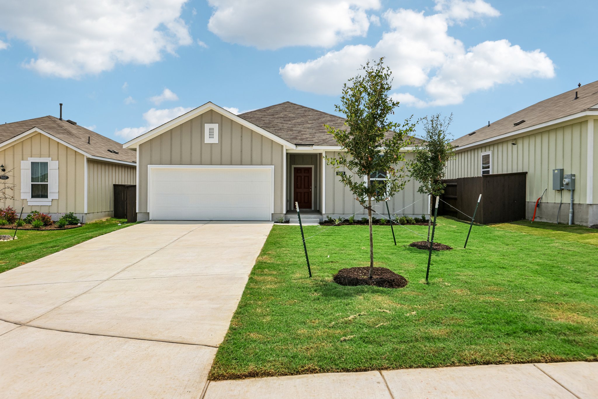 5513 Sacra Cove Austin, TX 78747 - Photo 2 of 37 a house view with a garden space