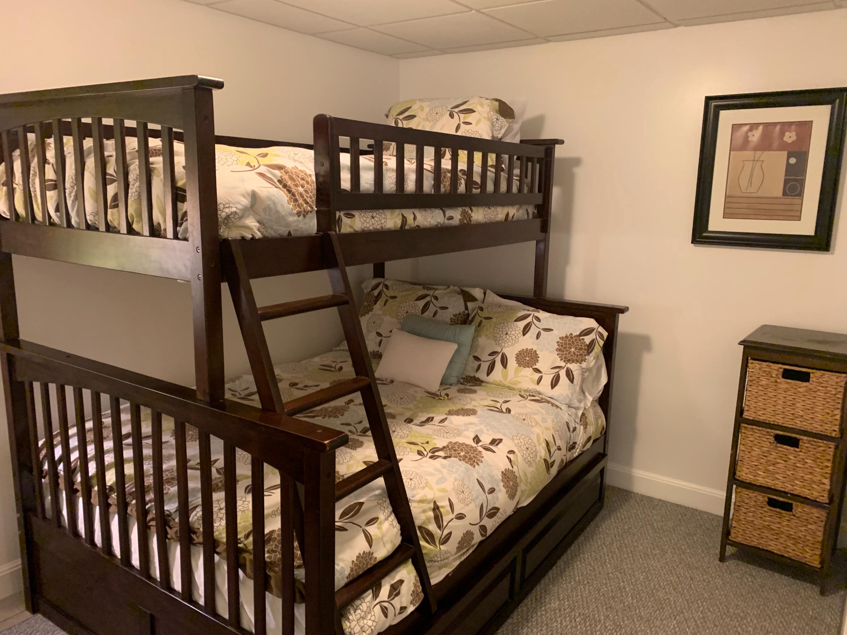 8 Fresh Pond Road Oak Bluffs, MA 02557 - Photo 26 of 36 a bed sitting in a bedroom next to a window