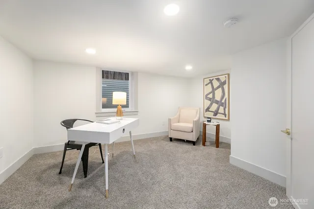 a workspace with furniture and window