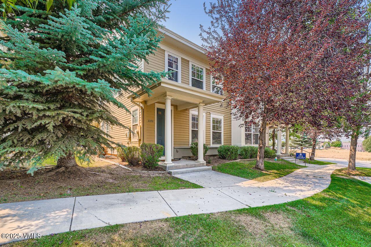 270 Founders Avenue Eagle, CO 81631 - Photo 1 of 28 a front view of a house with a yard and trees