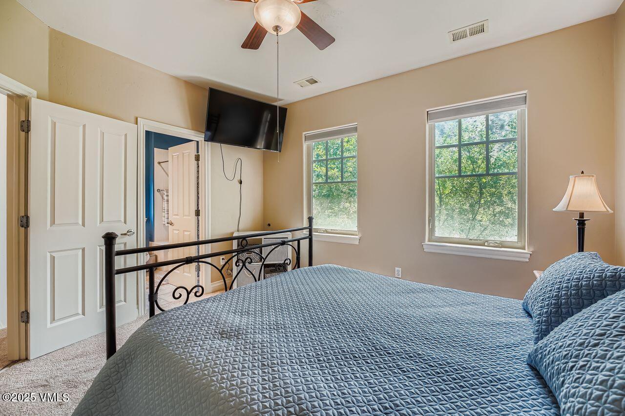270 Founders Avenue Eagle, CO 81631 - Photo 16 of 28 a bedroom with a large bed and a window