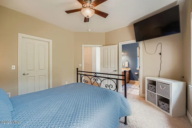 a view of a livingroom with furniture and a flat screen tv