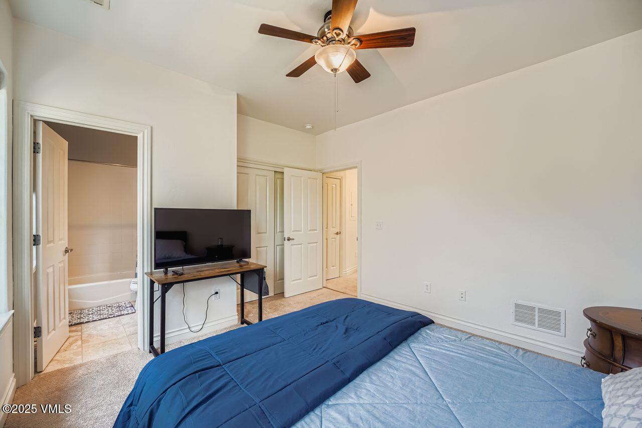 270 Founders Avenue Eagle, CO 81631 - Photo 21 of 28 a bedroom with a bed and a flat screen tv