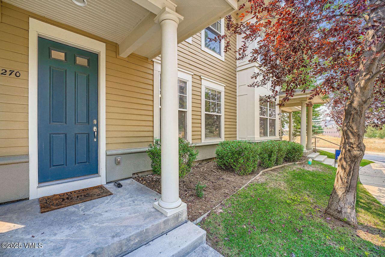 270 Founders Avenue Eagle, CO 81631 - Photo 28 of 28 a front view of a house with a yard and garage