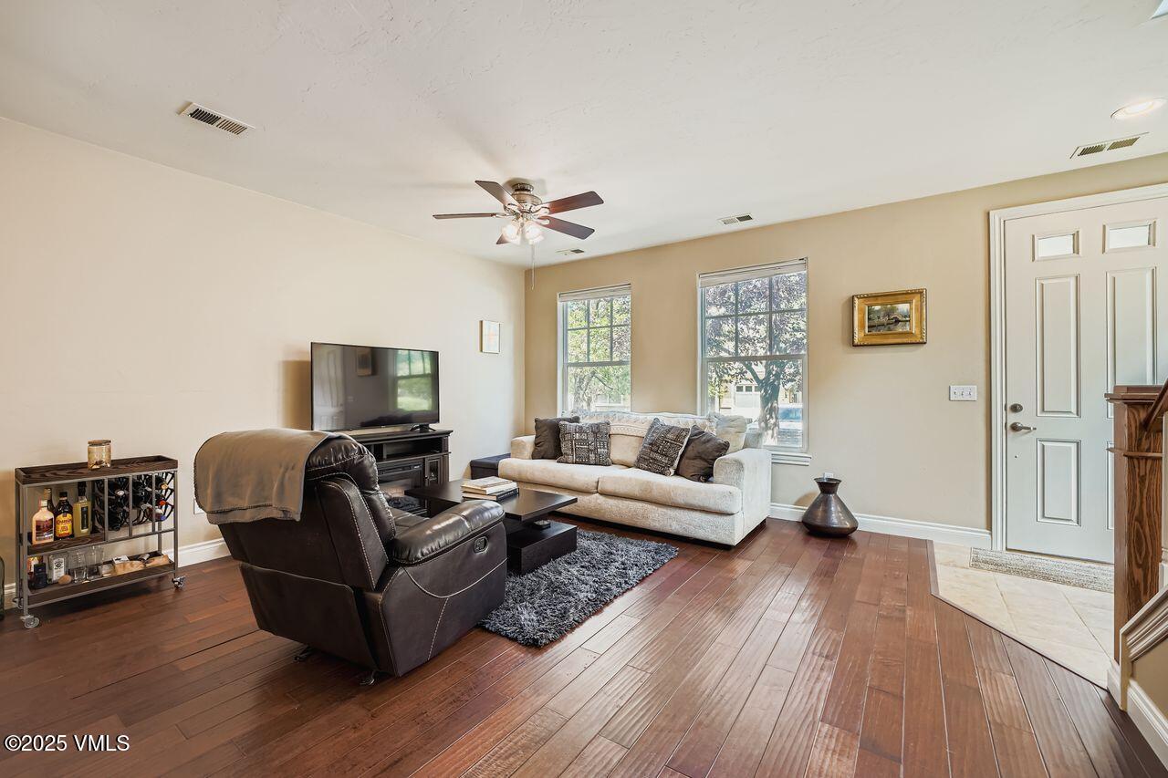 270 Founders Avenue Eagle, CO 81631 - Photo 7 of 28 a living room with furniture and a wooden floor