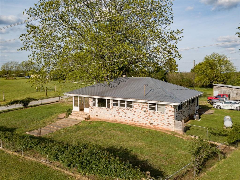 707 North County Line Road Alto, GA 30510 - Photo 1 of 1 a front view of a house with garden