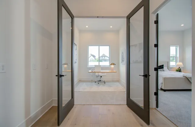 a bathroom with a bathtub and a window