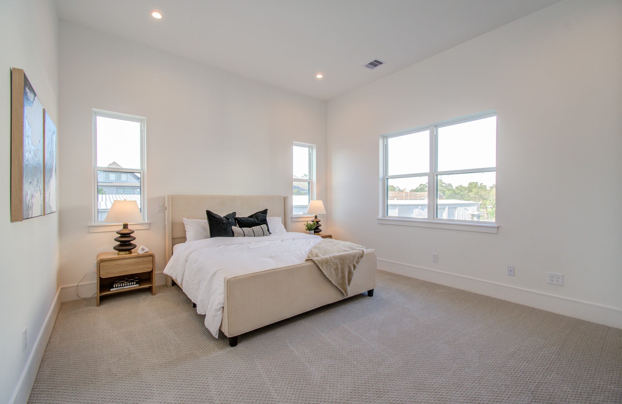 1643 Bingle Road Houston, TX 77055 - Photo 32 of 50 a spacious bedroom with a bed and a window