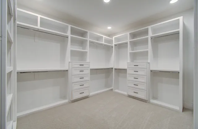 a view of an empty walk in closet