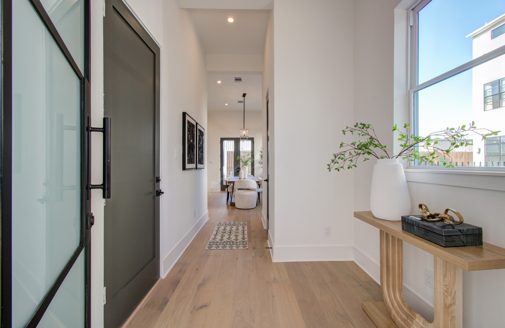 1643 Bingle Road Houston, TX 77055 - Photo 8 of 50 a view of a hallway view with wooden floor and a potted plant