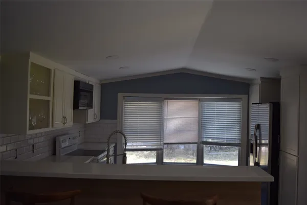 a kitchen that has a sink and a window