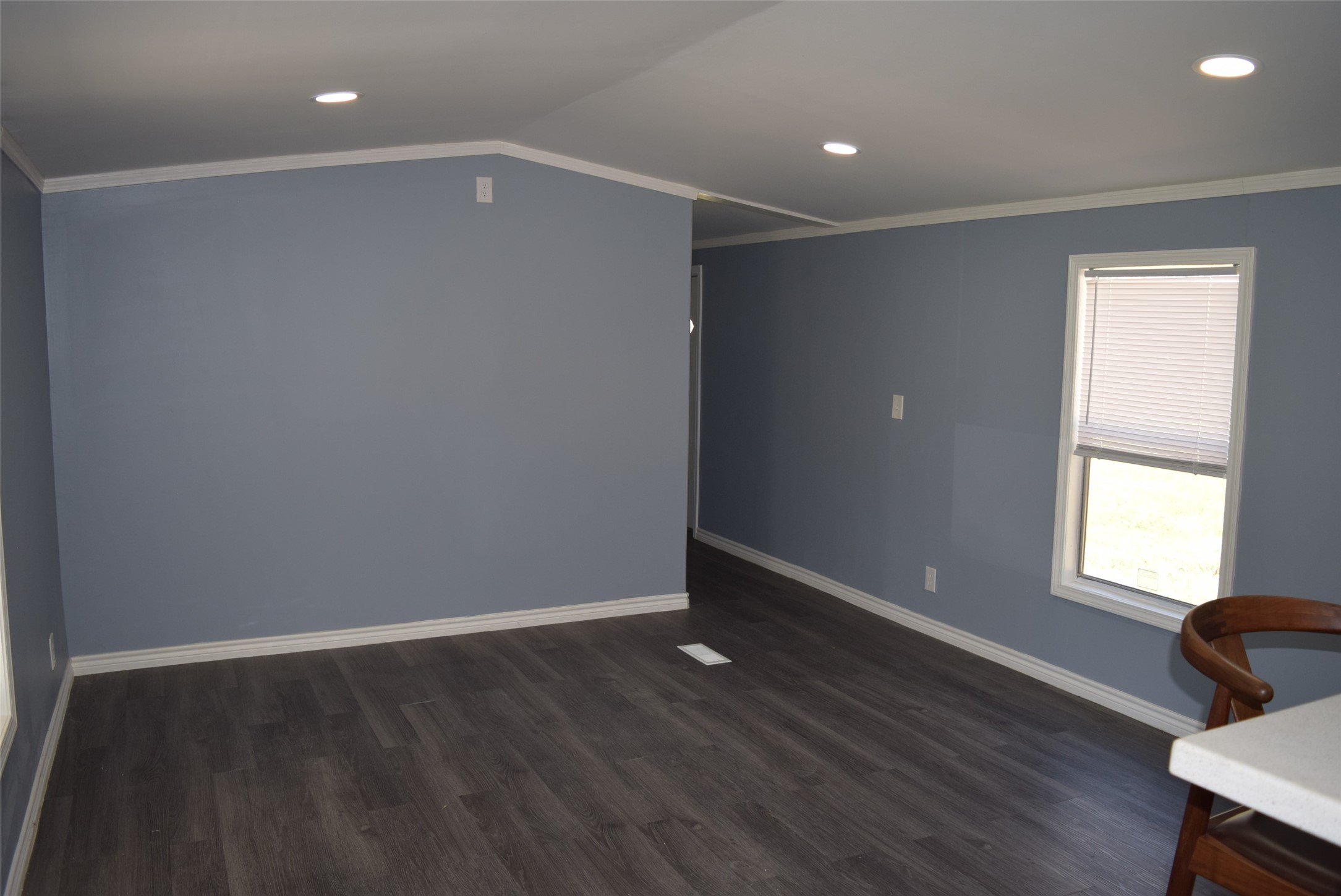 161 Irene Street Shepherd, TX 77371 - Photo 15 of 27 an empty room with wooden floor and windows
