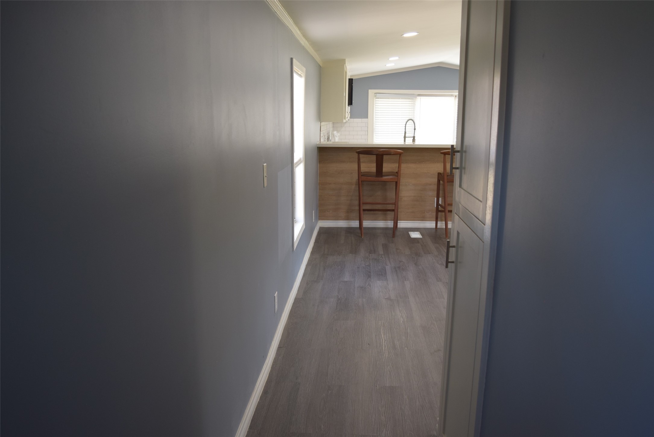 161 Irene Street Shepherd, TX 77371 - Photo 16 of 27 a view of a hallway and a sink and a window in a bathroom