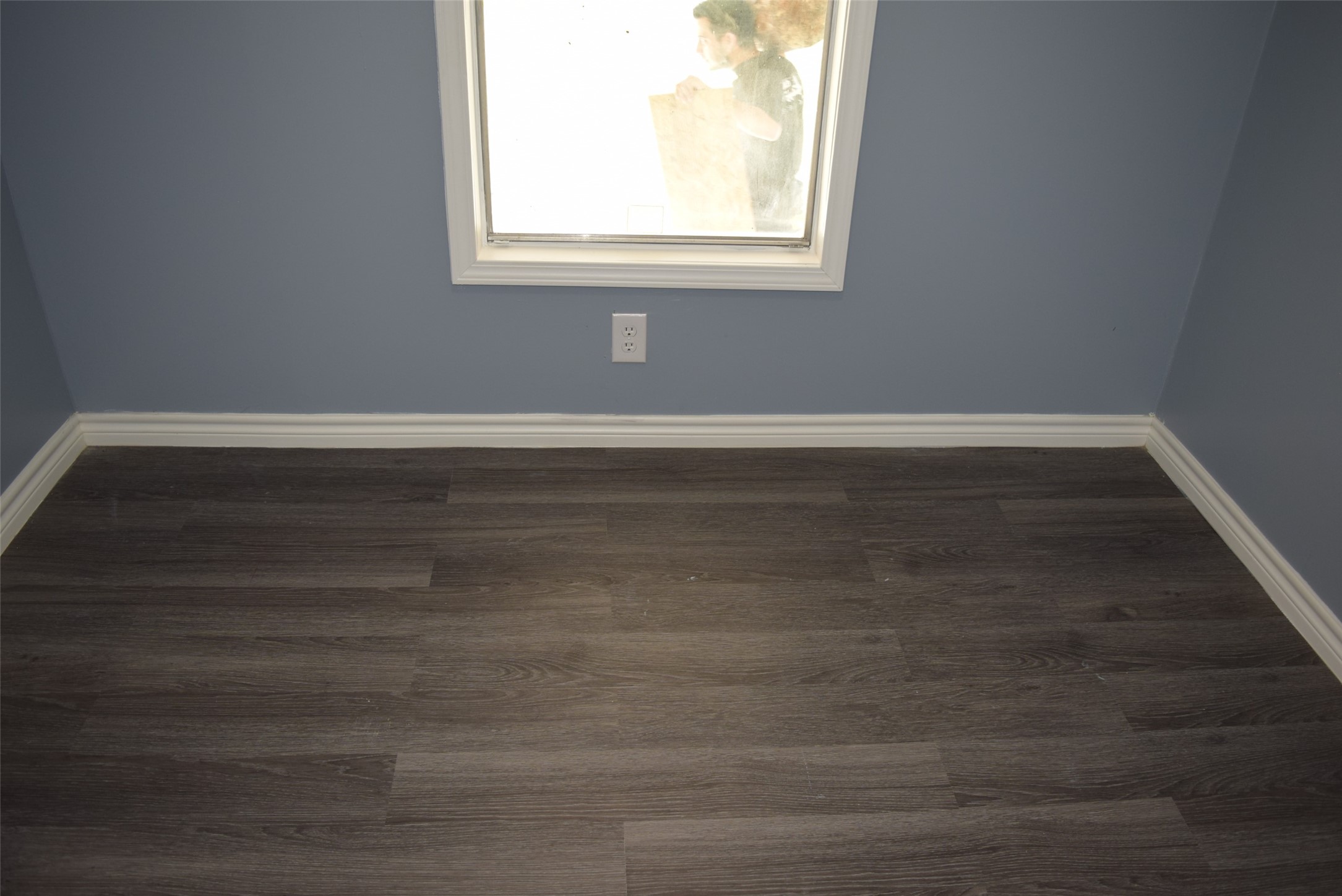 161 Irene Street Shepherd, TX 77371 - Photo 20 of 27 a view of a small space with wooden floor and a window