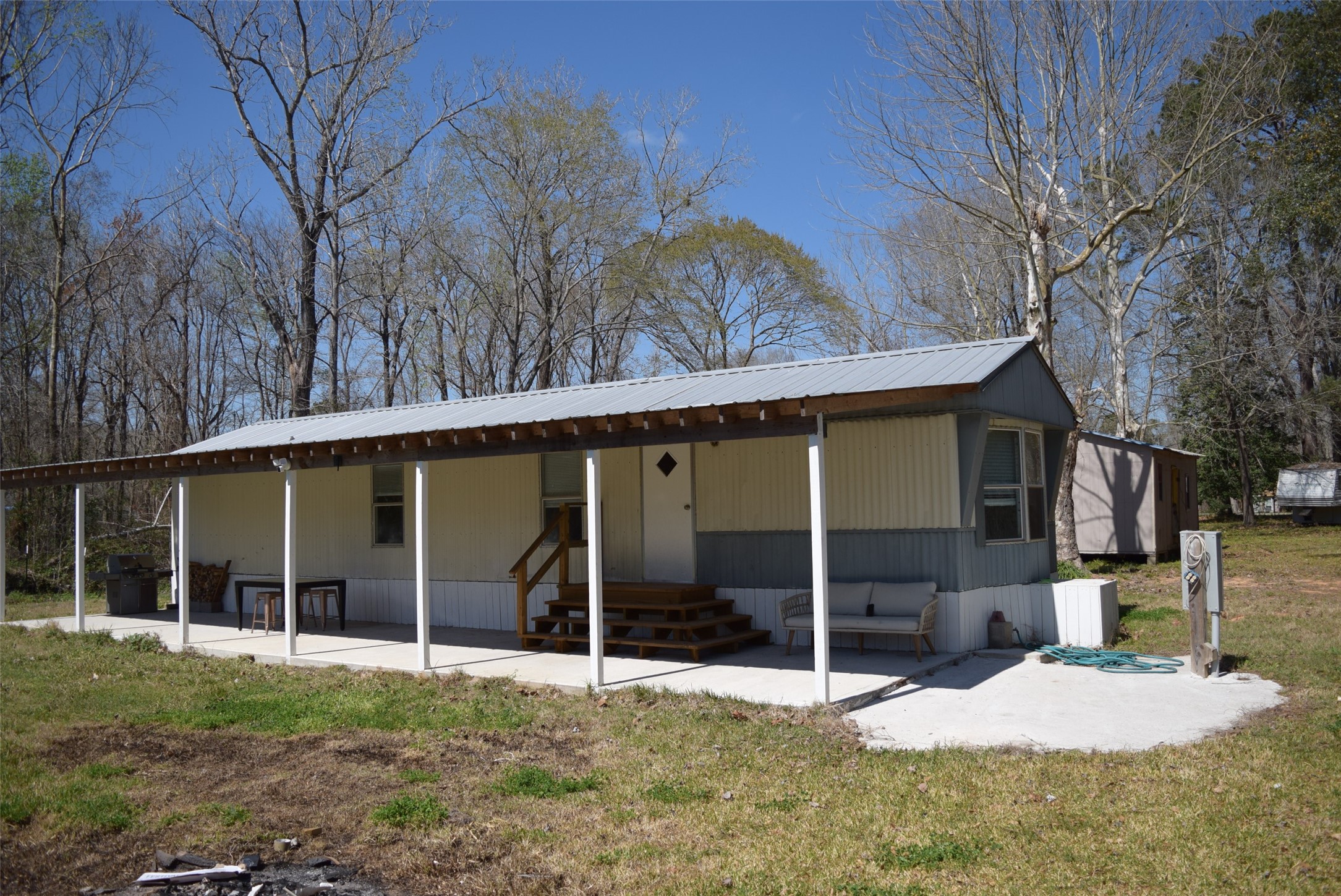161 Irene Street Shepherd, TX 77371 - Photo 3 of 27 a view of a house with a yard and large tree