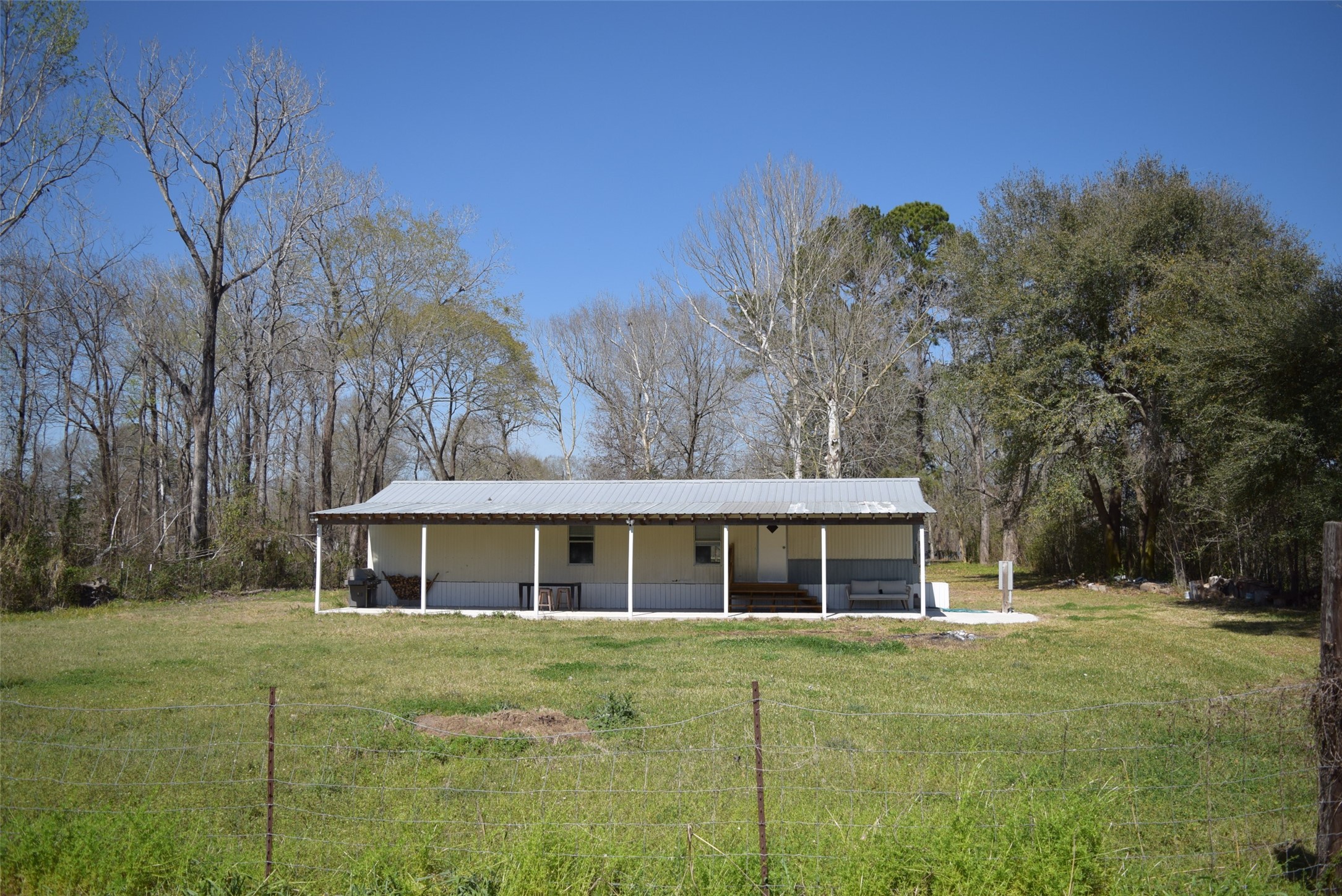 161 Irene Street Shepherd, TX 77371 - Photo 5 of 27 a front view of house with yard and trees around