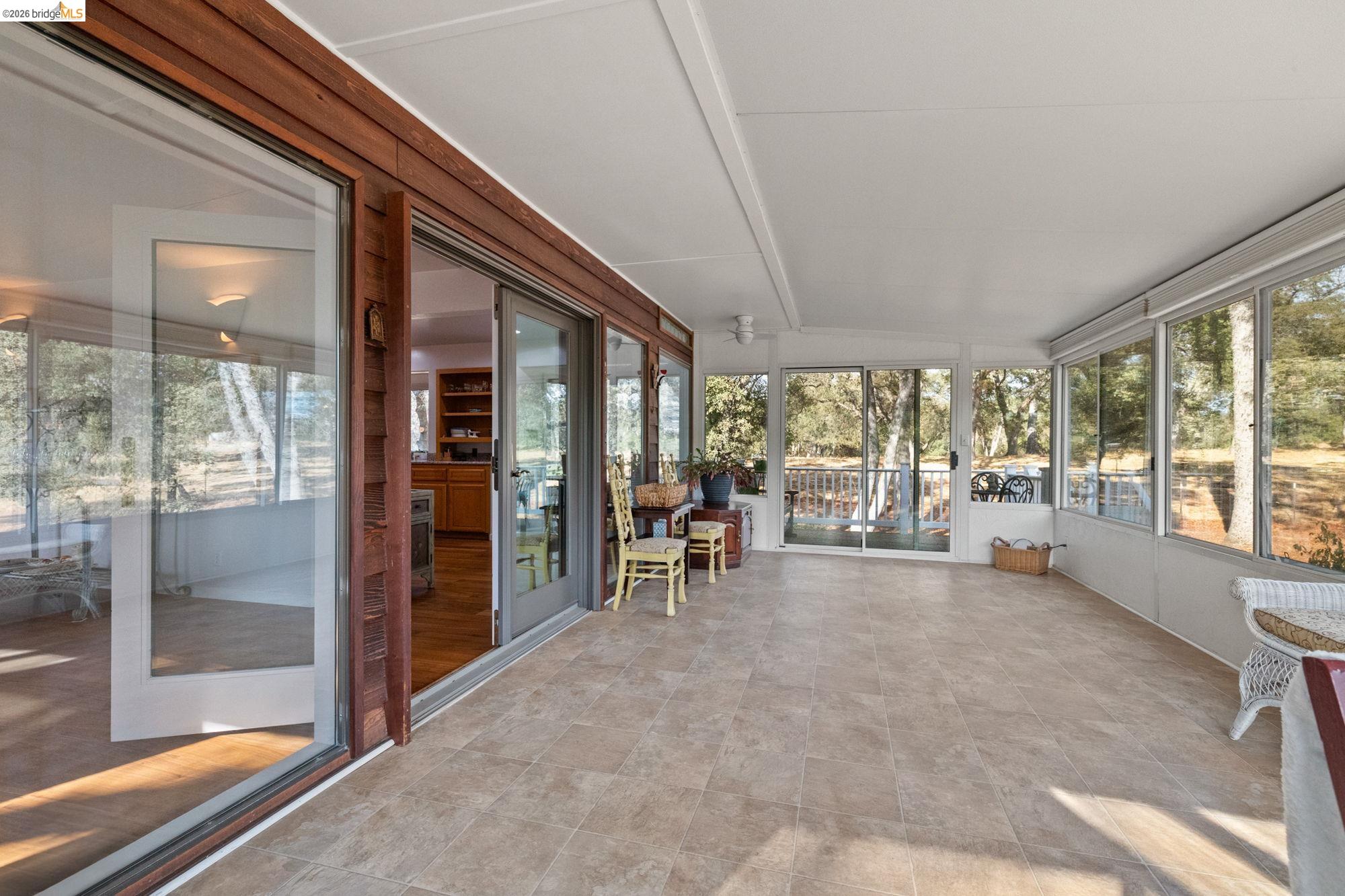10566 Thistle Down Road Jamestown, CA 95327 - Photo 21 of 53 Sunroom with lofted ceiling and plenty of natural light